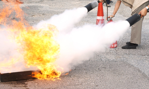 Fire,Fighting,Training,,Carbon,Dioxide,Sprayed,From,Fire,Extinguishers,By
